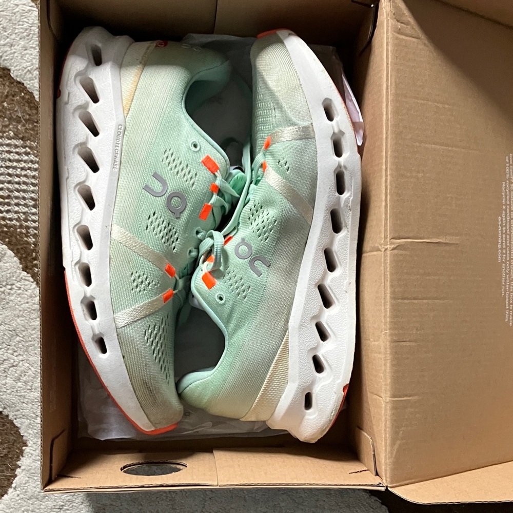 On Running Cloudsurfer in Light Green and Bright Orange